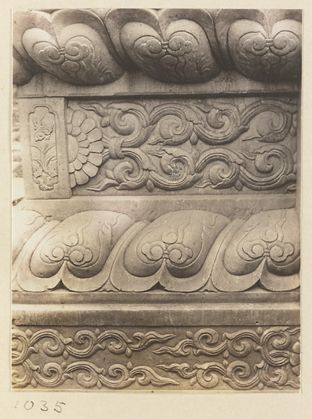 Detail of Liu li pai fang showing marble relief work with floral motifs at Pu tuo zong cheng miao