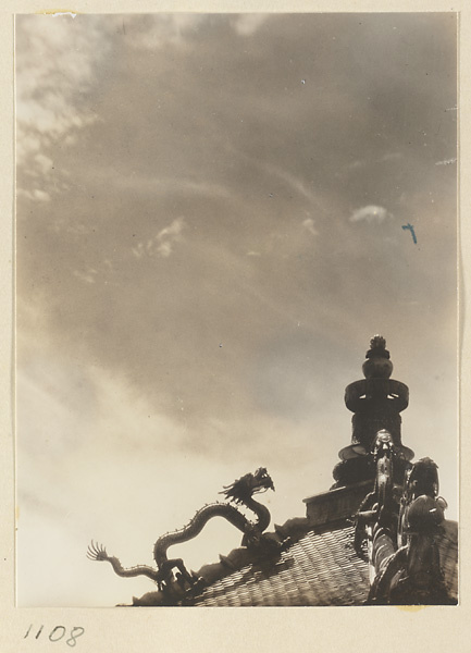 Detail showing double-eaved roof of Miao gao zhuang yan dian with dragons