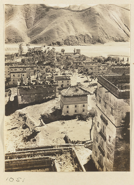 General view of the southwest corner of the temple complex at Pu tuo zong cheng miao showing Bai tai, Wu ta bai tai, and mountains to the south