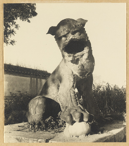 Statue of a lion with a ball in the village of Miyun