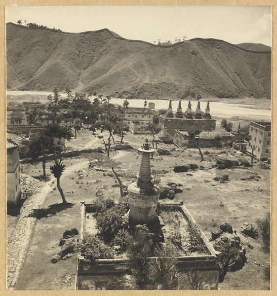 General view of the southern half of the temple complex at Pu tuo zong cheng miao showing Bai tai with stupa-type pagodas on the roofs and Re River in the background