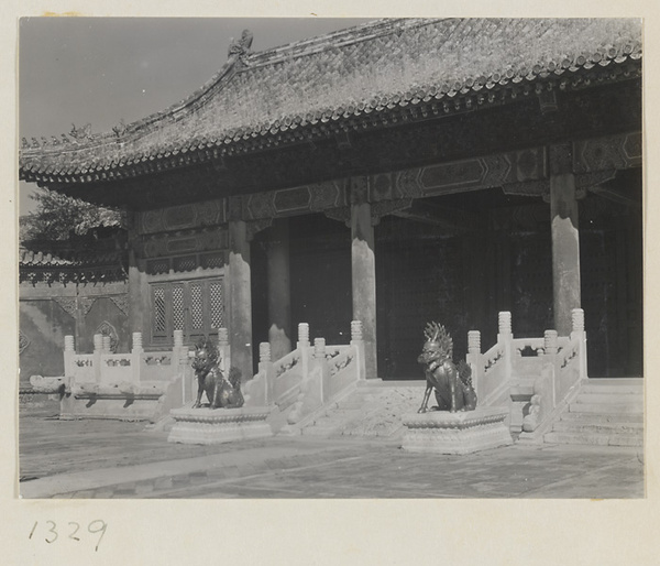 Detail of a building in the Forbidden City showing the entrance with two qi lin