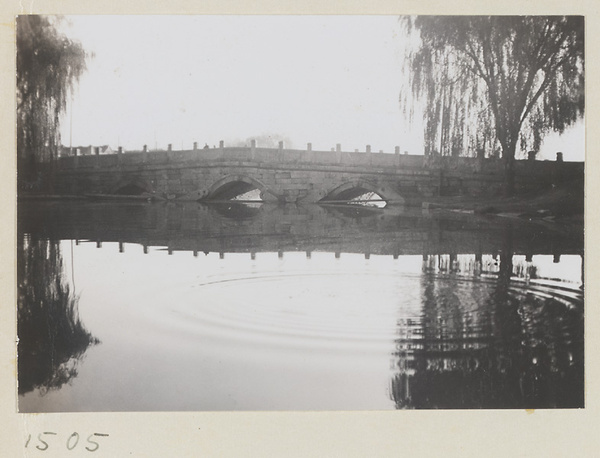 Triple-arched stone bridge