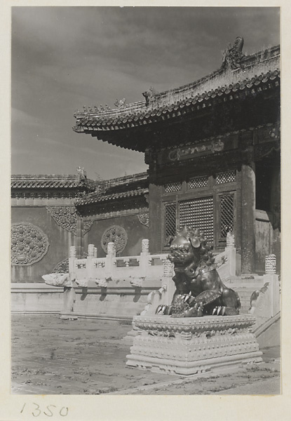 Detail of Qian qing men showing flanking walls with glazed-tile relief work and a bronze lion with a cub