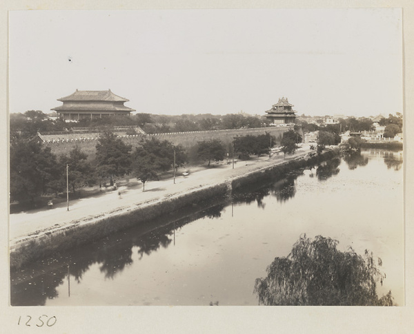 Moat, wall, gate with double-eaved roof, and corner watchtower of the Forbidden City