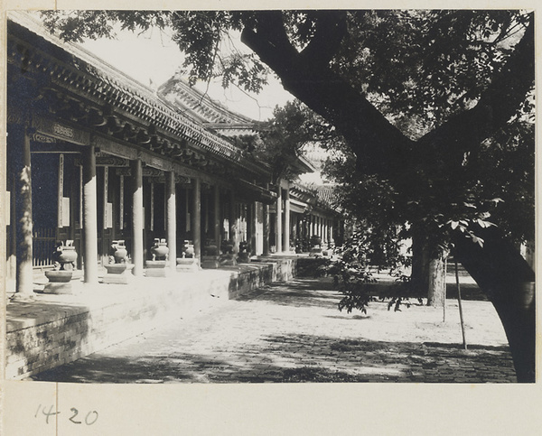 Facade of a temple building with columnaded porch and incense burners at Dong yue miao