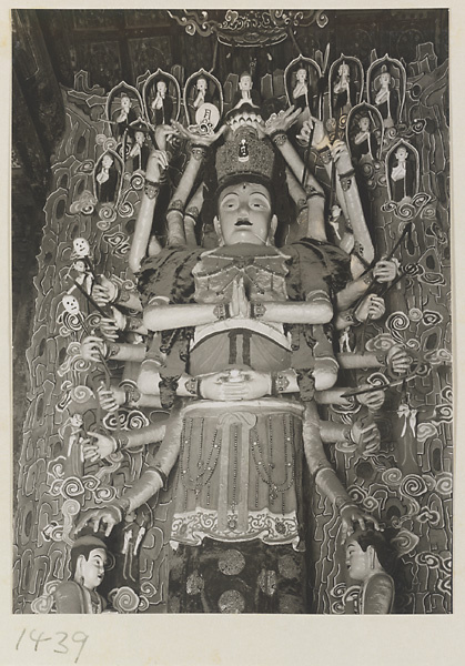 Statue of a multi-armed Bodhisattva with attendants at Da Fo si