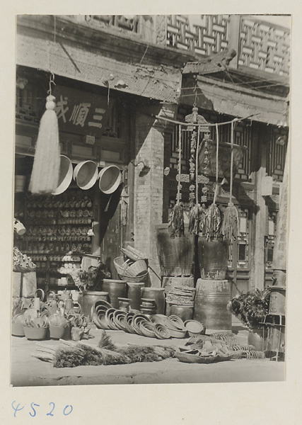 Facade of a shop selling household goods with shop signs for hemp products (left) and soap (right)