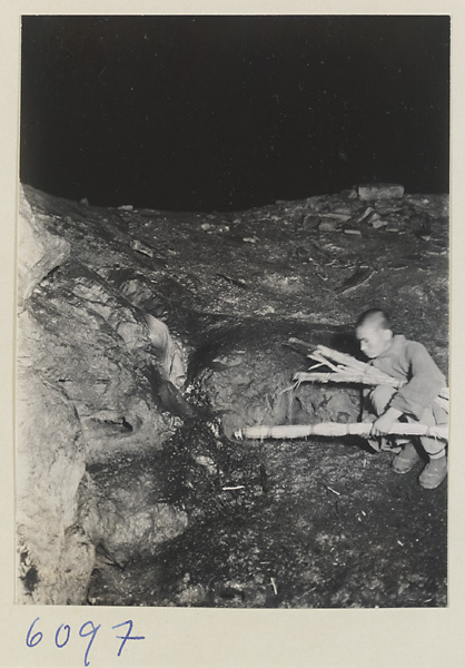 Cave interior showing a man at the Xincheng Caves