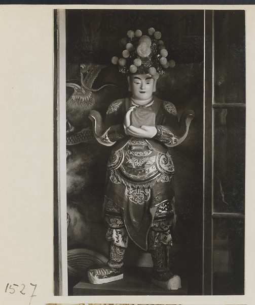 Interior of Lao ye miao showing a shrine figure in a glass case