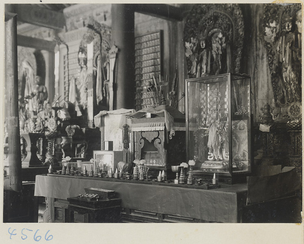 Interior of temple building at Yong he gong showing altars with Lamaist deities