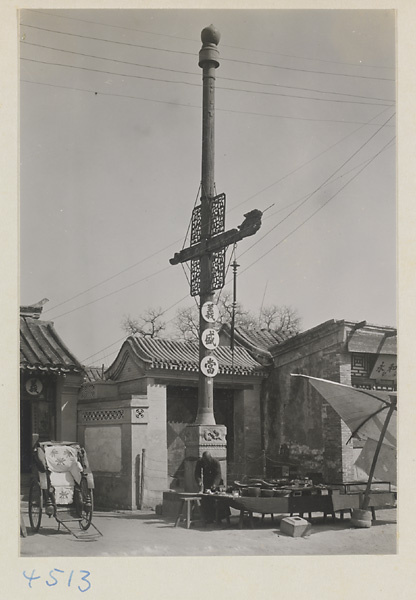 Facade of a pawn shop with shop signs and rickshaw