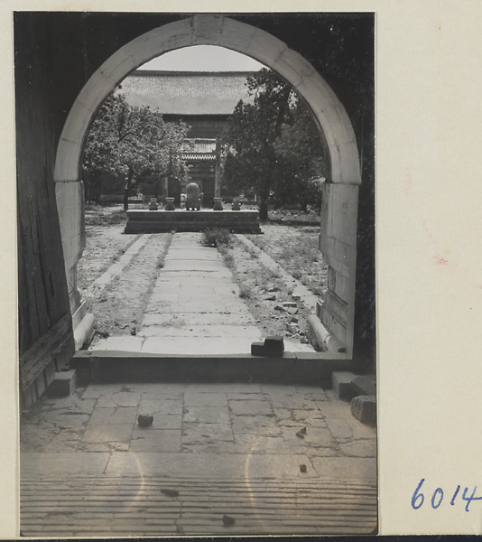 Altar with ritual objects and protective screen in third courtyard at Chang ling seen from inside Fang cheng