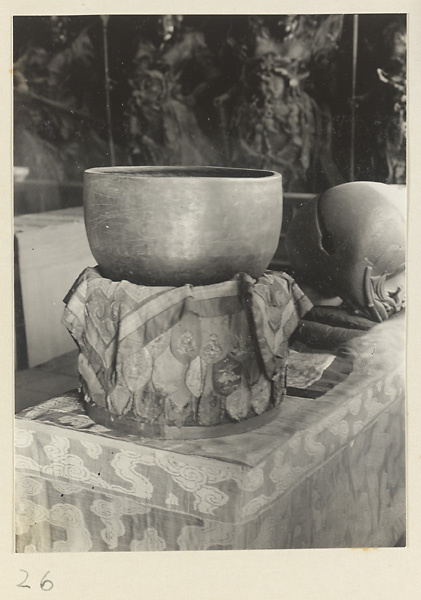 Musical instruments resting on altar cloths with embroidered votive offerings at Xi yu si