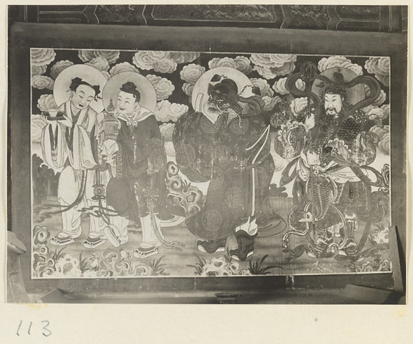 Shrine interior at Hei long tan showing a mural with four figures