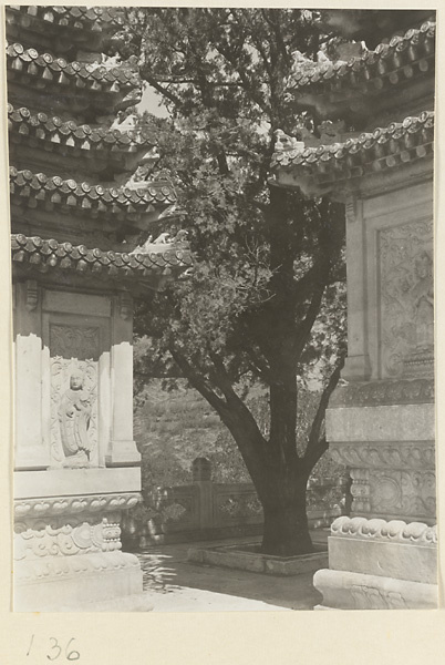 Detail of Jin gang ta at Bi yun si showing pagodas with relief carvings and roof ornaments