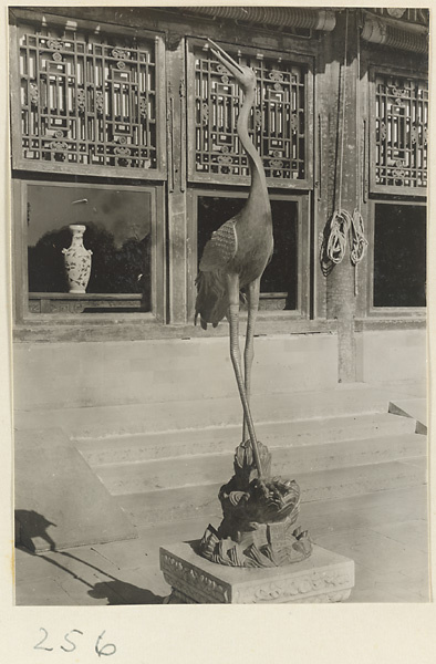 Bronze crane in front of Luo shou tang