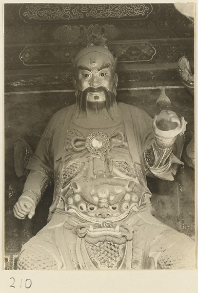 Statue of a shrine figure holding a gourd at the Old Wu Garden