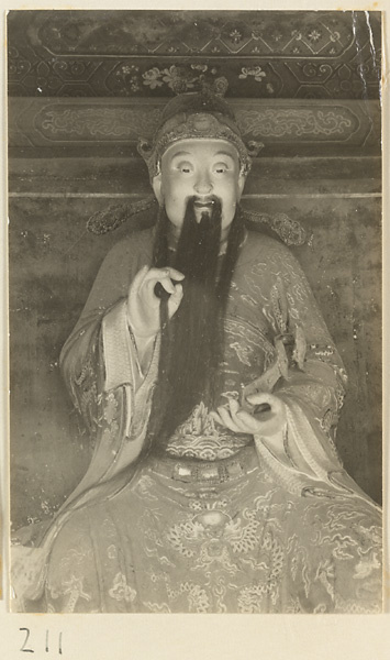 Bearded shrine figure holding a ru yi sceptre at the Old Wu Garden