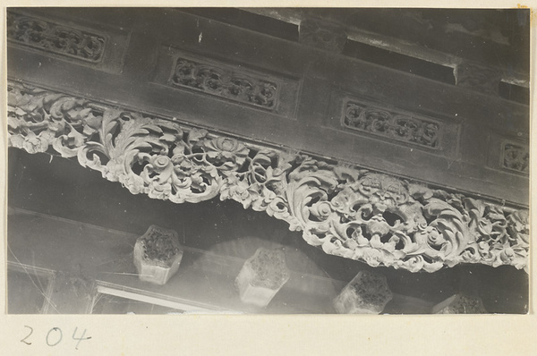 Building detail showing relief carving with floral motif at the Old Wu Garden
