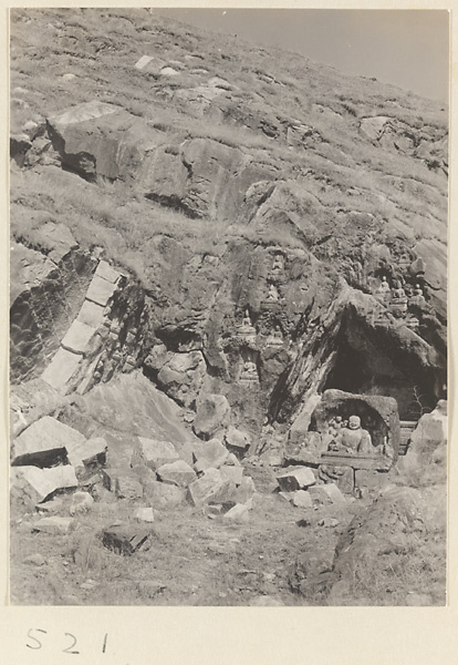 Buddha reliefs cut into the hillside at Yuquan Hill