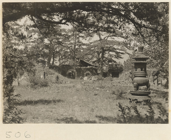 Incense burner and gate on temple grounds at Yuquan Hill