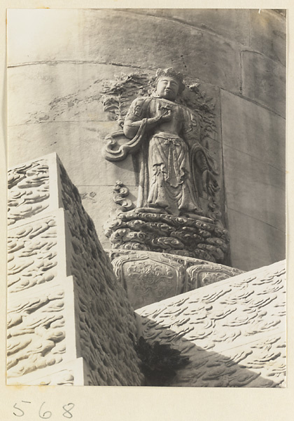 Detail of a stupa-style pagoda showing a relief figure of a Bodhisattva at Huang si