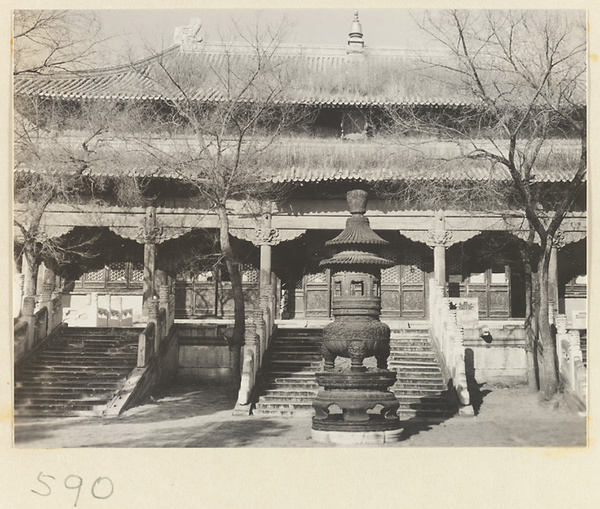 Double-eaved temple building with terrace and incense burner at Huang si