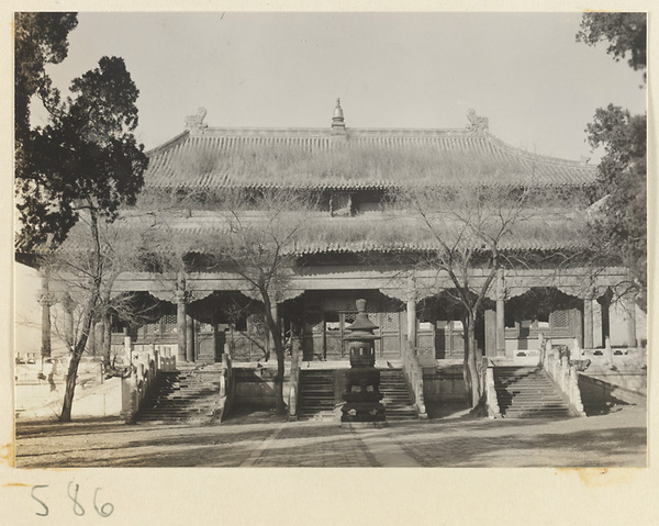 Double-eaved temple building with terrace and incense burner at Huang si