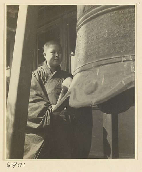 Buddhist nun striking a bell