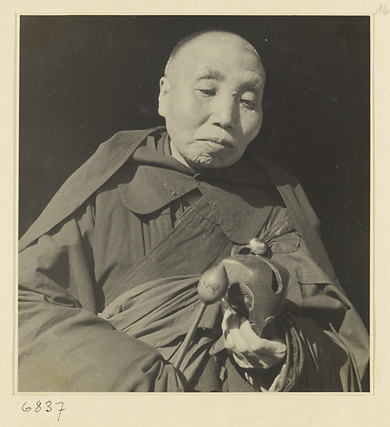 Buddhist nun striking a mu yu