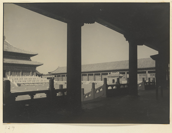 Detail of south facade of Qian dian, East Wing, glazed-tile sacrificial stove for burning paper and silk offerings, and main courtyard at Tai miao seen from Zai men