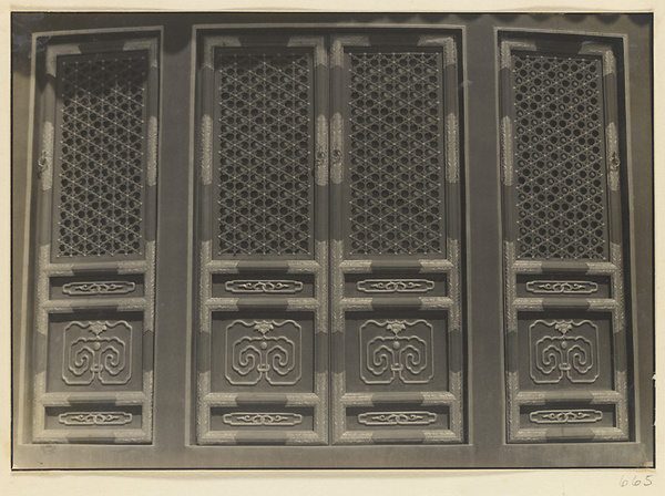 Exterior detail of Qi nian dian showing doors with latticework, metal decoration, and ru yi motif