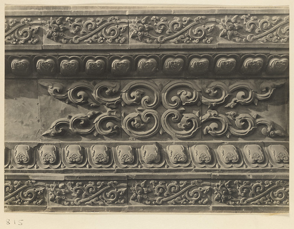 Detail of base of Jiu long bi showing glazed tiles with floral motifs