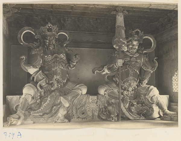 Interior of temple building at Beihai Gong Yuan showing two of the four celestial kings