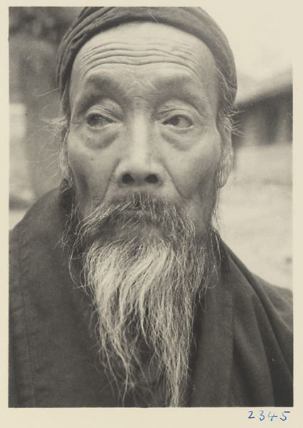 Daoist priest wearing a hat at Bai yun guan