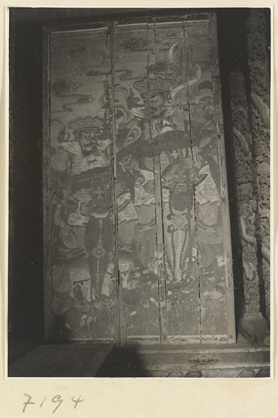 Interior of a temple building at Jie tai si showing a painting of two of the four celestial kings