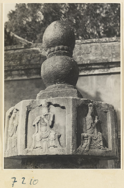 Detail showing carved relief figures on a free-standing stone column at Jie tai si