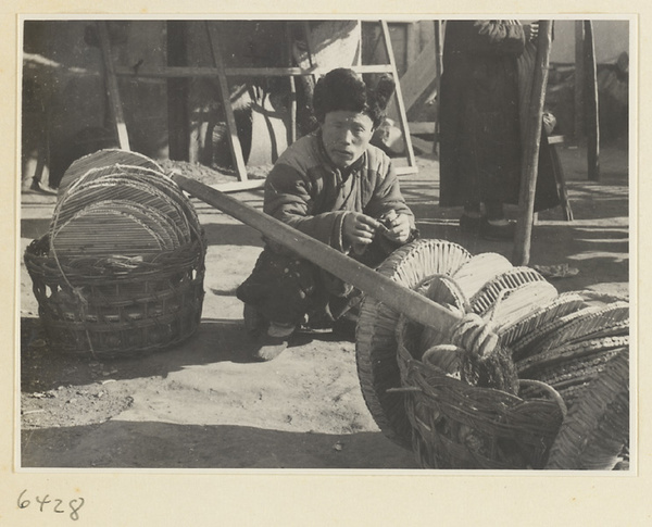 Vendor selling small round mats