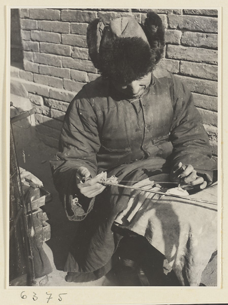 Itinerant ceramic repairman at work