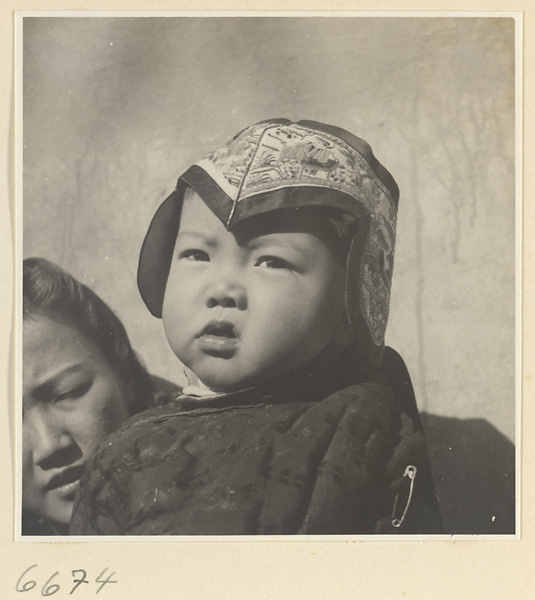 Woman and child wearing an embroidered hat