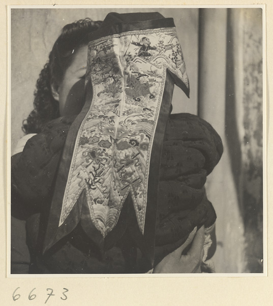 Woman and child wearing an embroidered hat