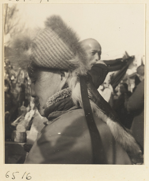 Man wearing a quilted, fur-lined hat