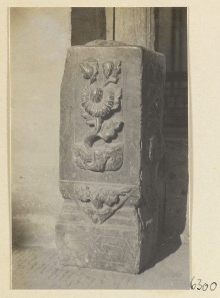 Carved door stone with floral motif