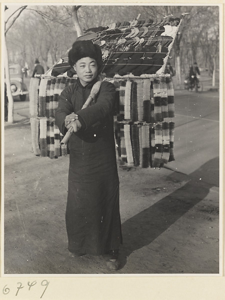 Hawker carrying his wares
