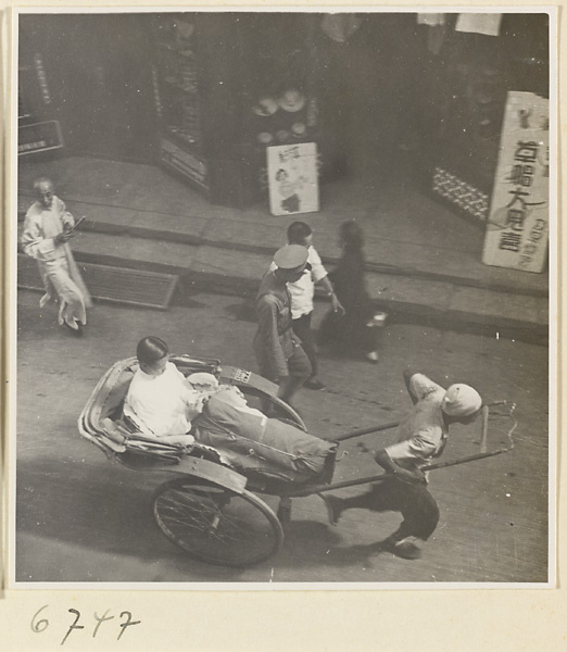 Street with rickshaw puller and pedestrians