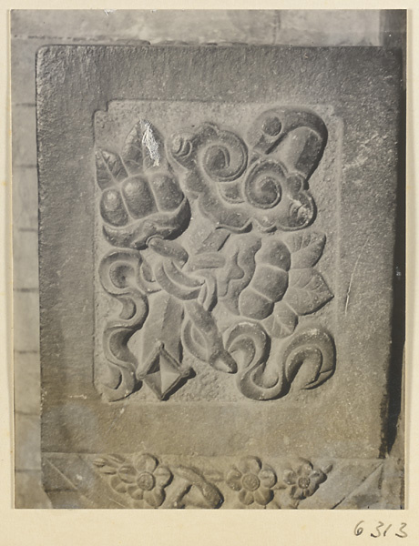 Carved door stone with ru yi sceptre, knot, and floral motifs