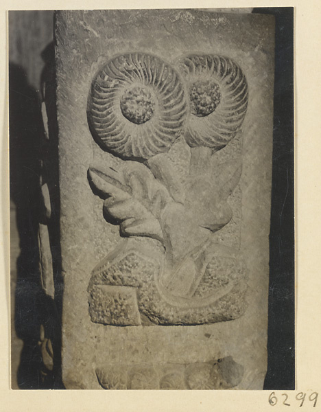 Carved door stone with floral motif