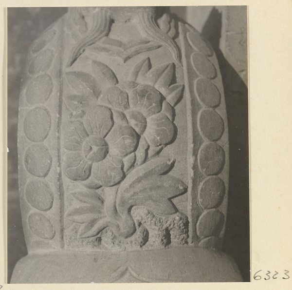 Carved door stone with floral motif