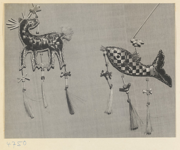 Souvenir animal figures made of braided colored straw at Bei'anhe